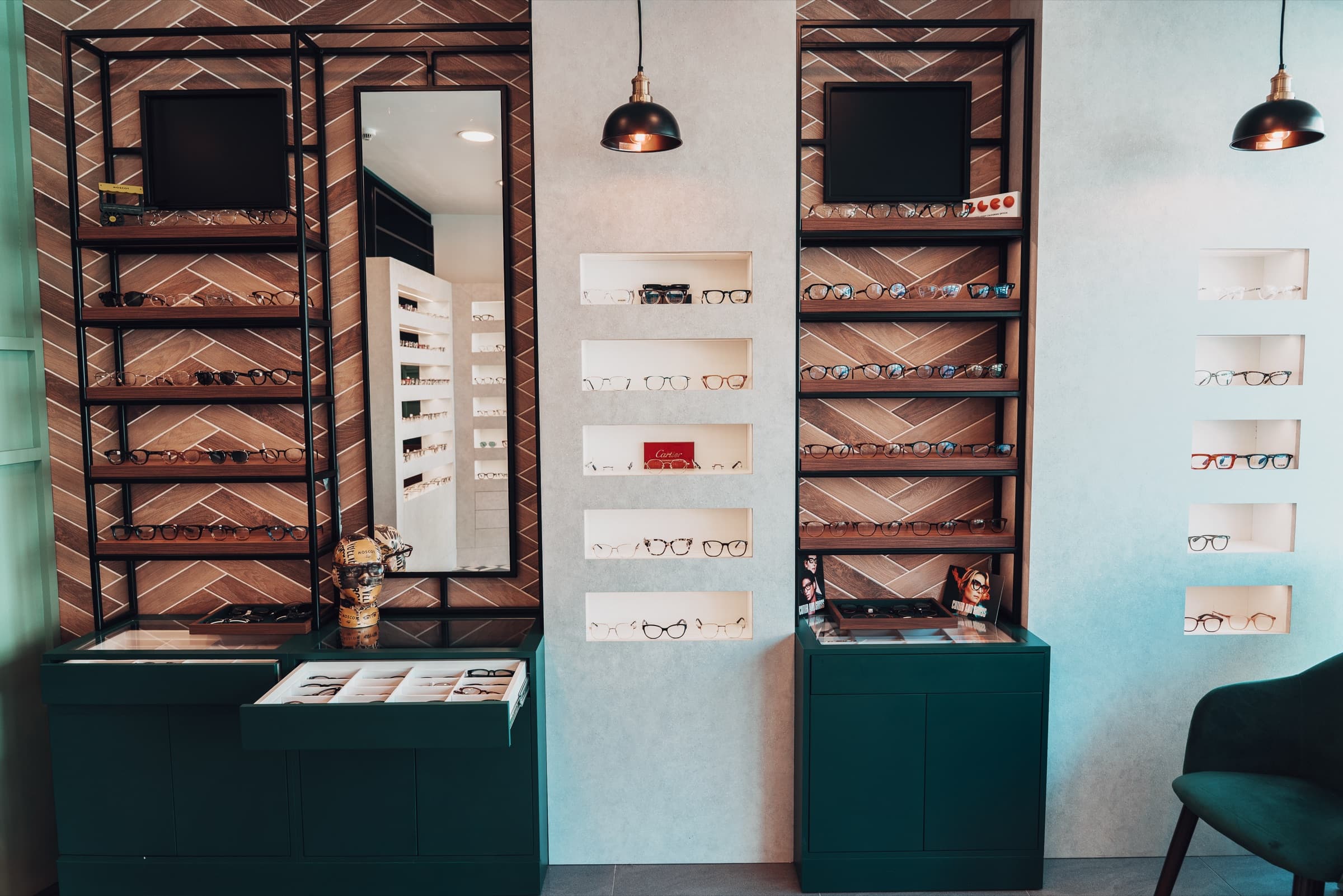 Symmetrical frame display walls with herringbone backing
